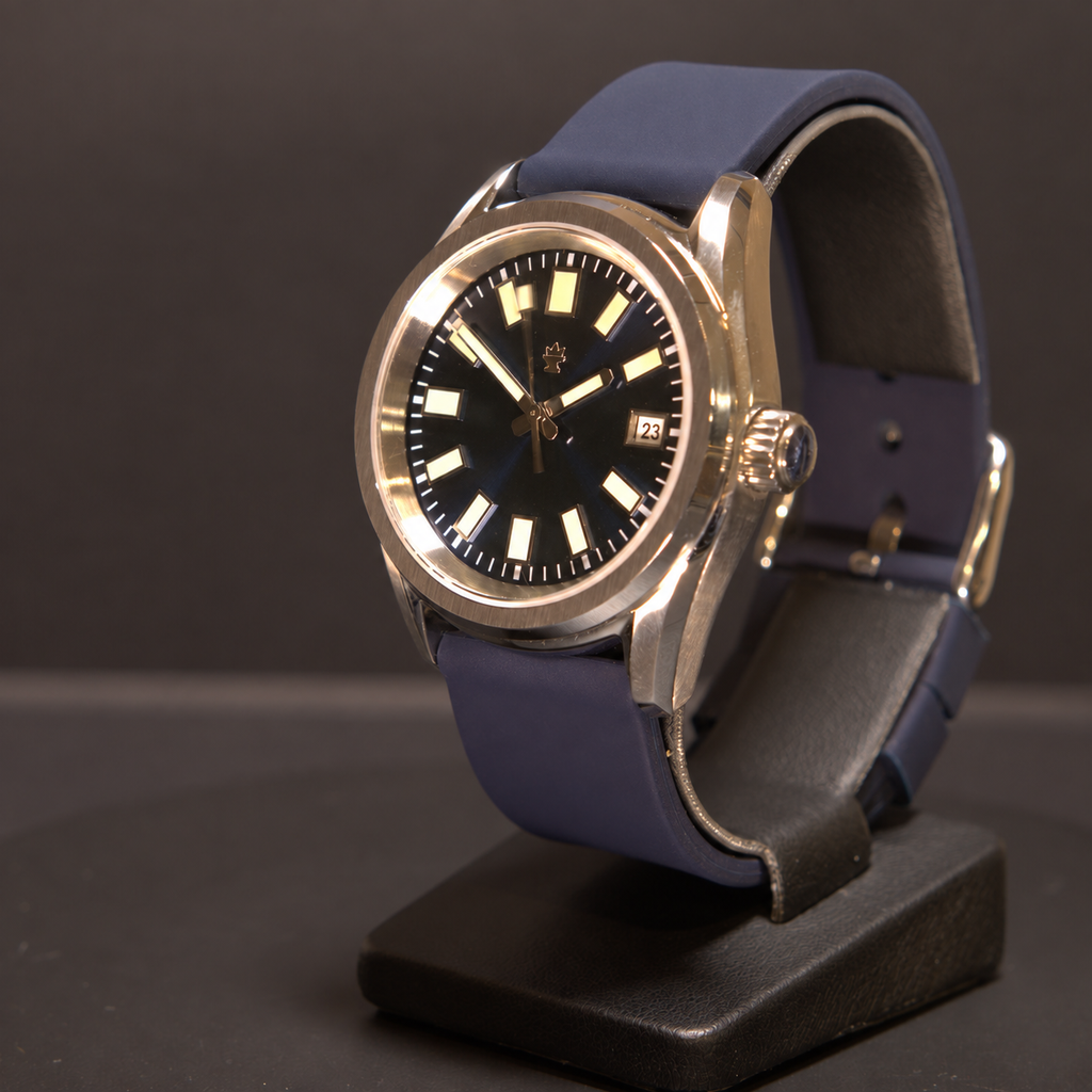 Crown Harbor Automatic from the crown side, showing its blue dial, winding crown, stainless steel case, and silicone strap