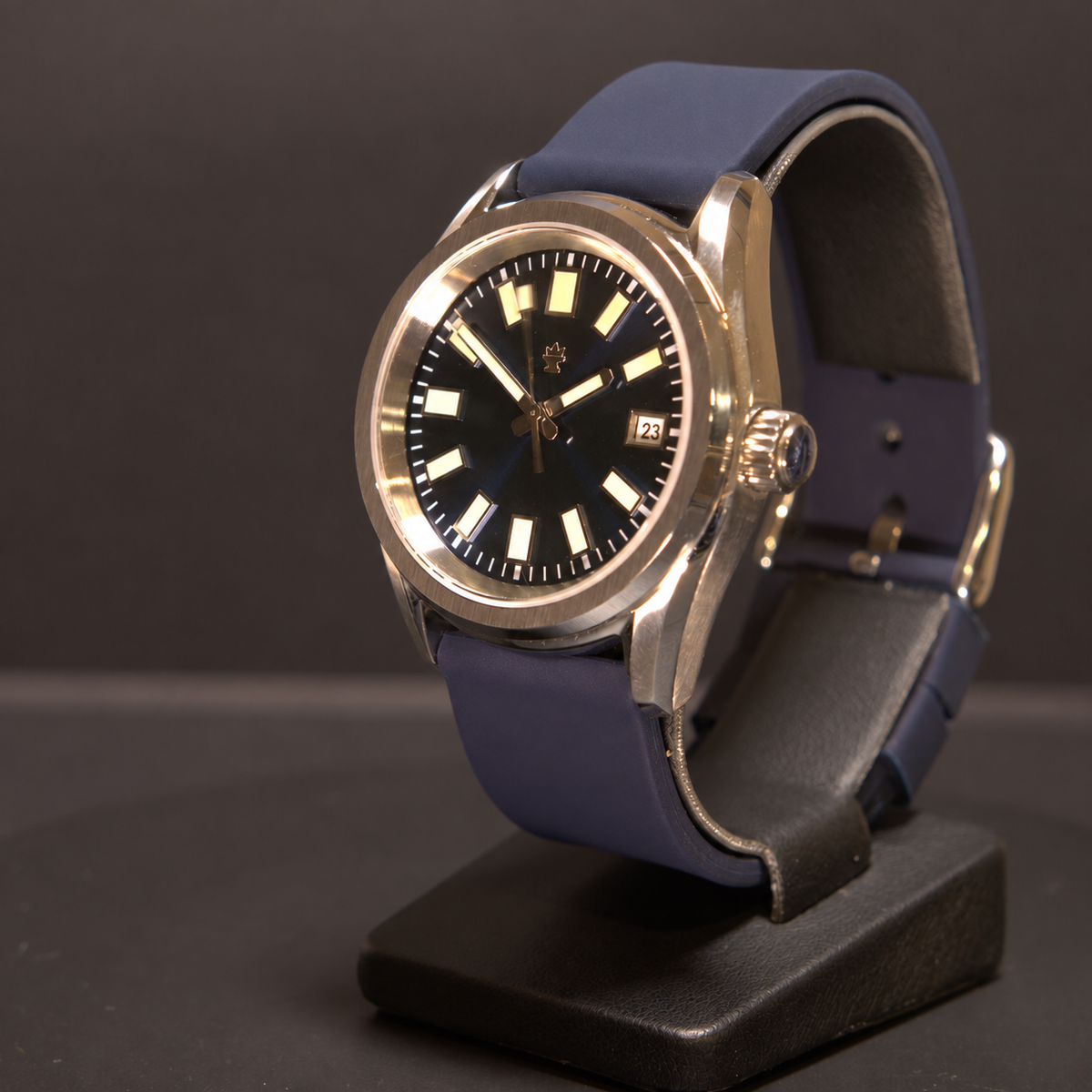 Crown Harbor Automatic from the crown side, showing its blue dial, winding crown, stainless steel case, and silicone strap